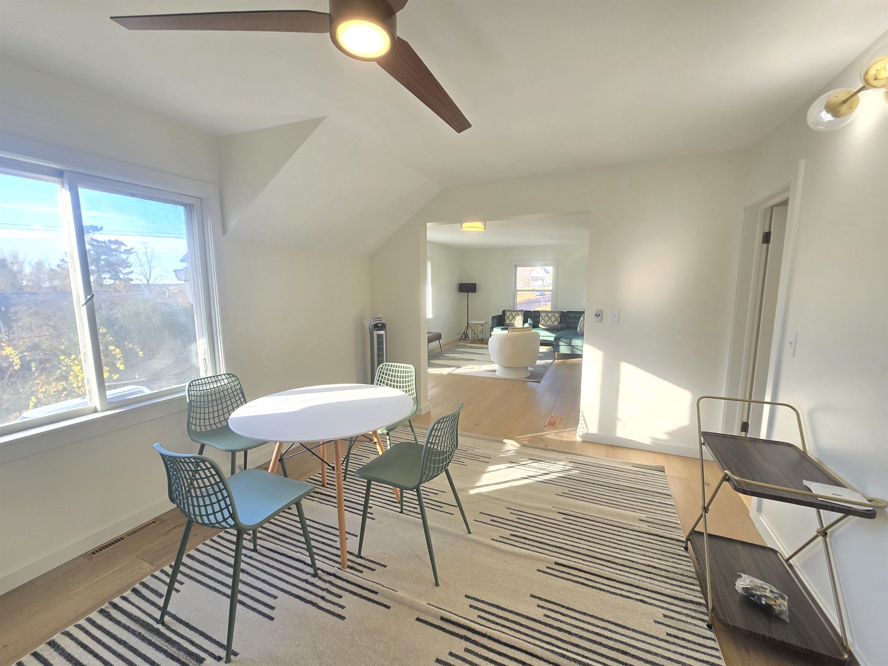 321 Rice Avenue Bayfield, WI 54814 - Photo 9 of 30 Kitchen with light engineered hardwood flooring, ceiling fan, and stainless steel refrigerator and range/oven