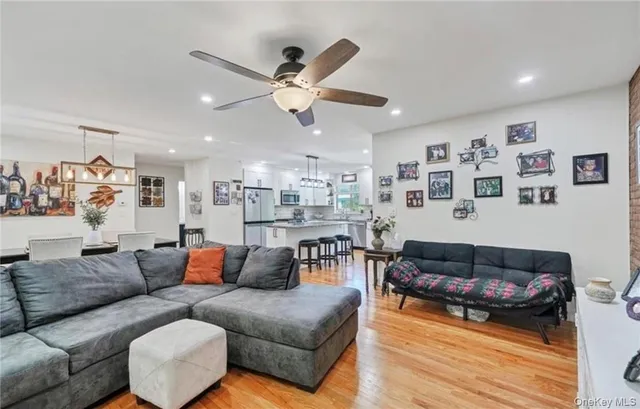 a living room with furniture and kitchen view