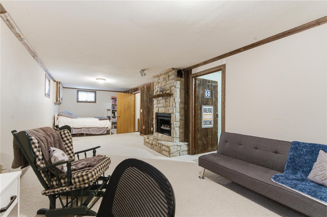 8747 Waynes Way Blanchester, OH 45107 - Photo 22 of 40 This versatile room offers comfort and a cozy fireplace, perfect for relaxation or a guest retreat.