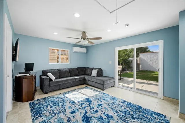 a living room with furniture and a window