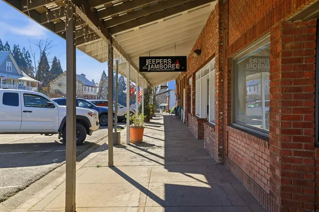 a front view of a building with retail shops