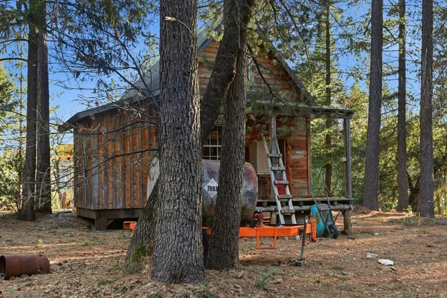 a view of a porch with furniture and a gate