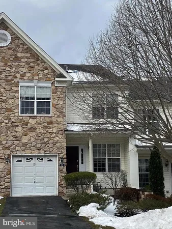 a front view of a house with outdoor space