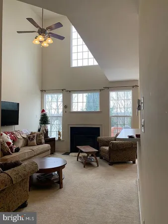 a room with a chair and white walls