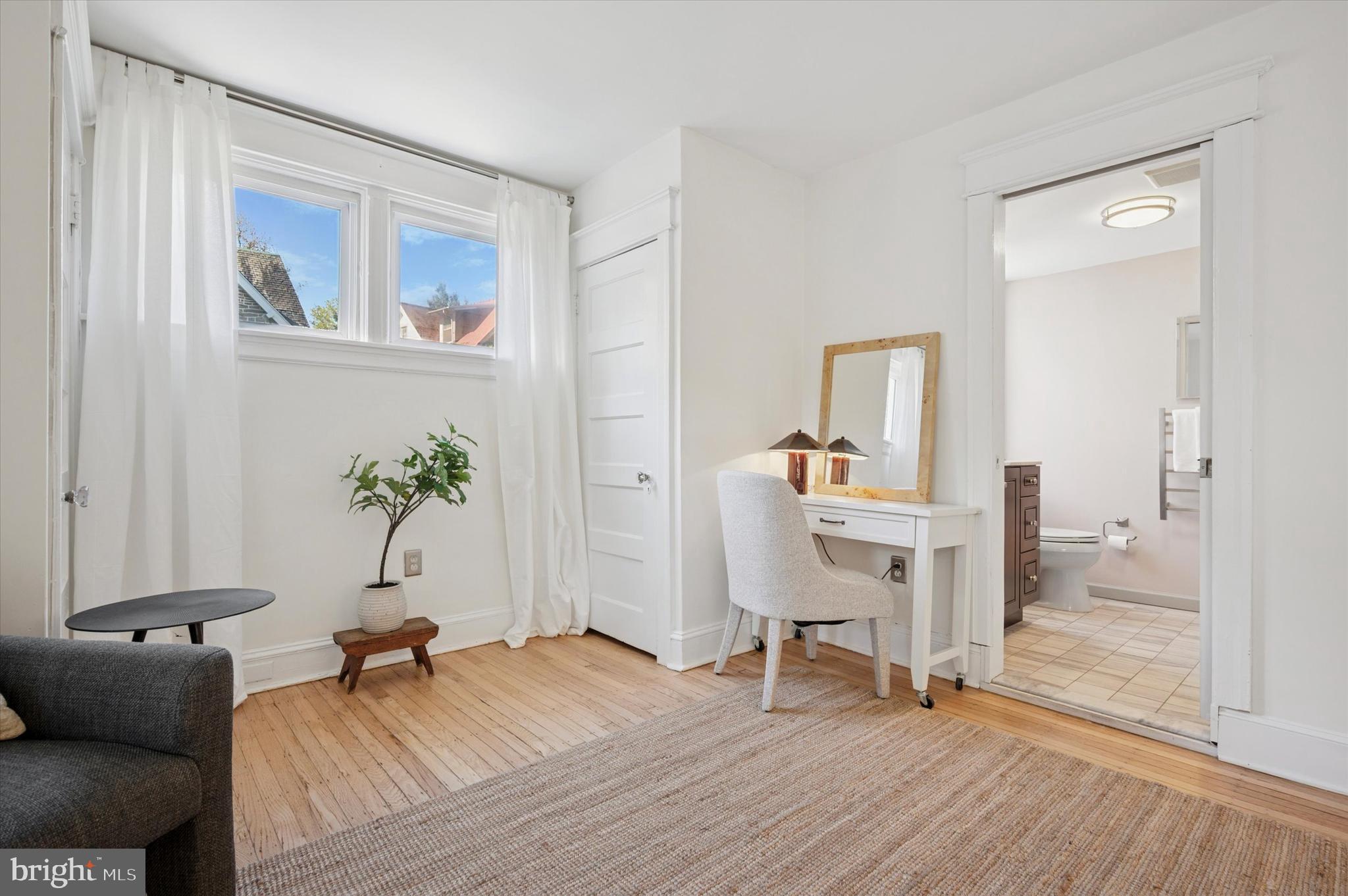 525 Burnham Road Philadelphia, PA 19119 - Photo 16 of 36 a living room with furniture and a wooden floor