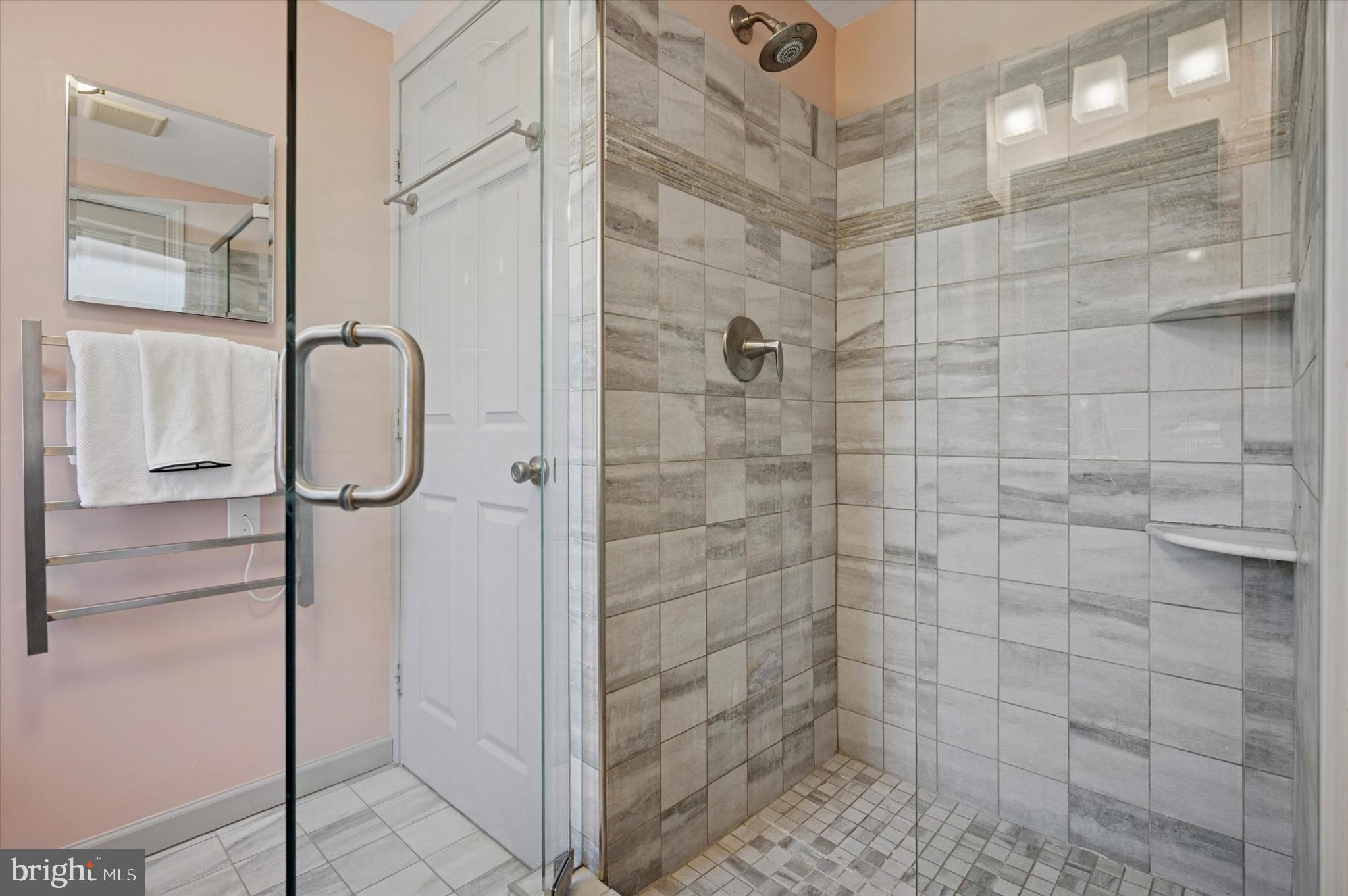 525 Burnham Road Philadelphia, PA 19119 - Photo 18 of 36 a bathroom with a glass shower door