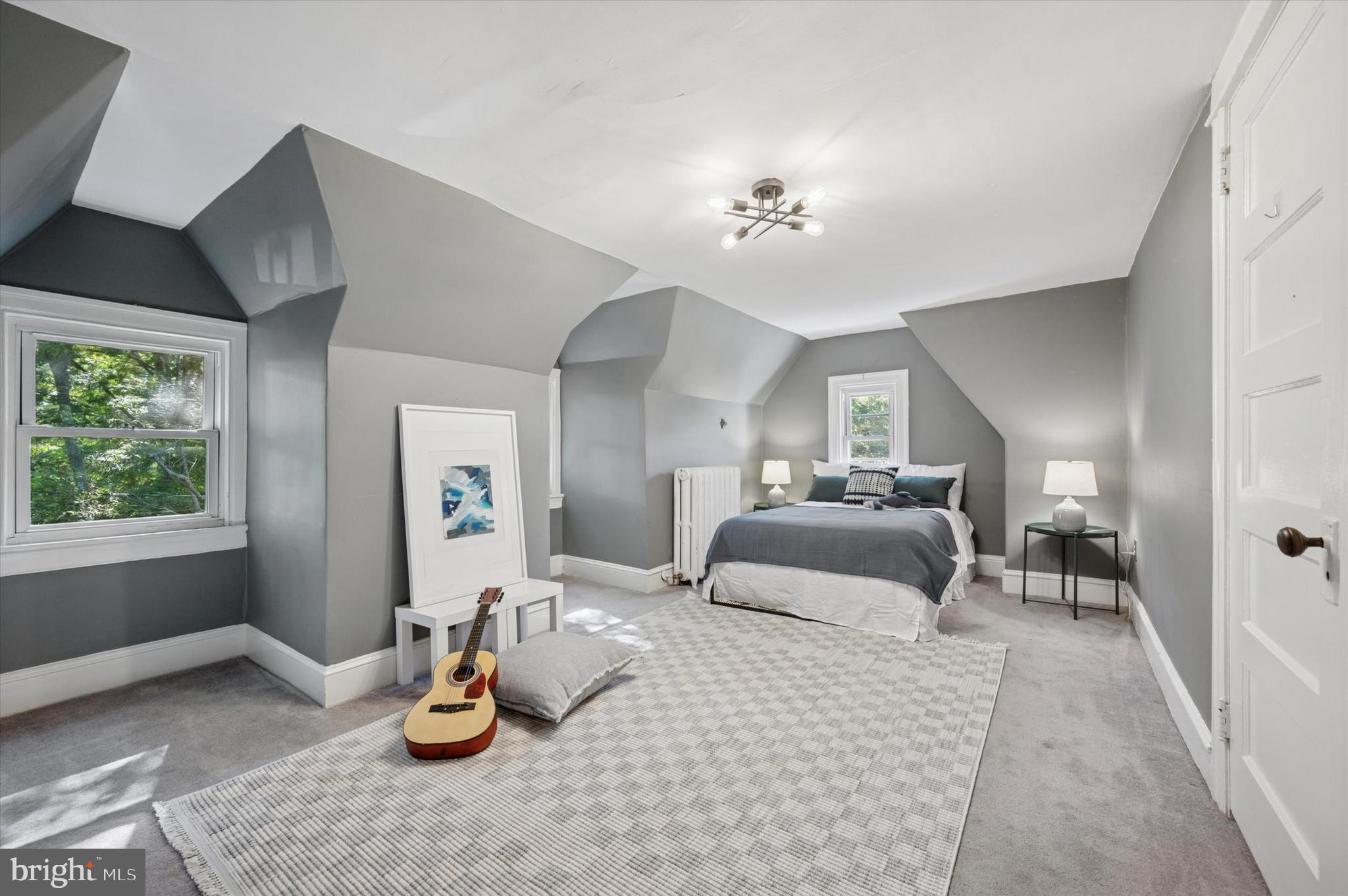 525 Burnham Road Philadelphia, PA 19119 - Photo 24 of 36 a bedroom with furniture and a chandelier