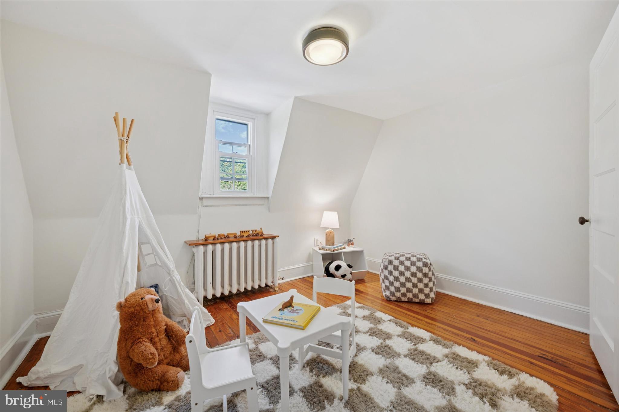 525 Burnham Road Philadelphia, PA 19119 - Photo 27 of 36 a bedroom with furniture and a window