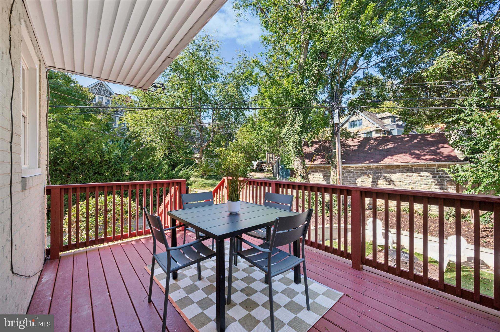 525 Burnham Road Philadelphia, PA 19119 - Photo 29 of 36 a balcony with wooden floor table and chairs