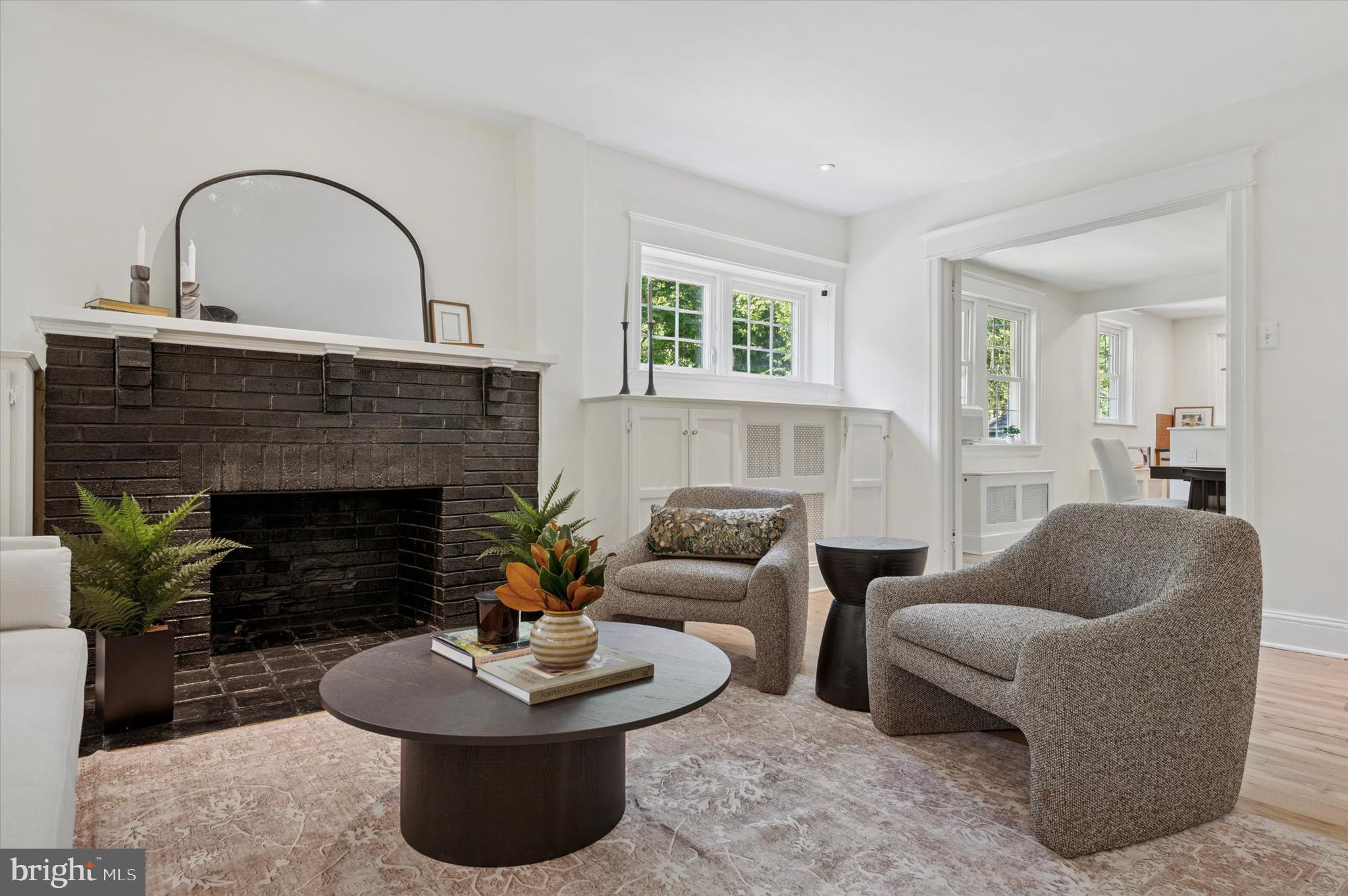 525 Burnham Road Philadelphia, PA 19119 - Photo 5 of 36 a living room with furniture and a fireplace