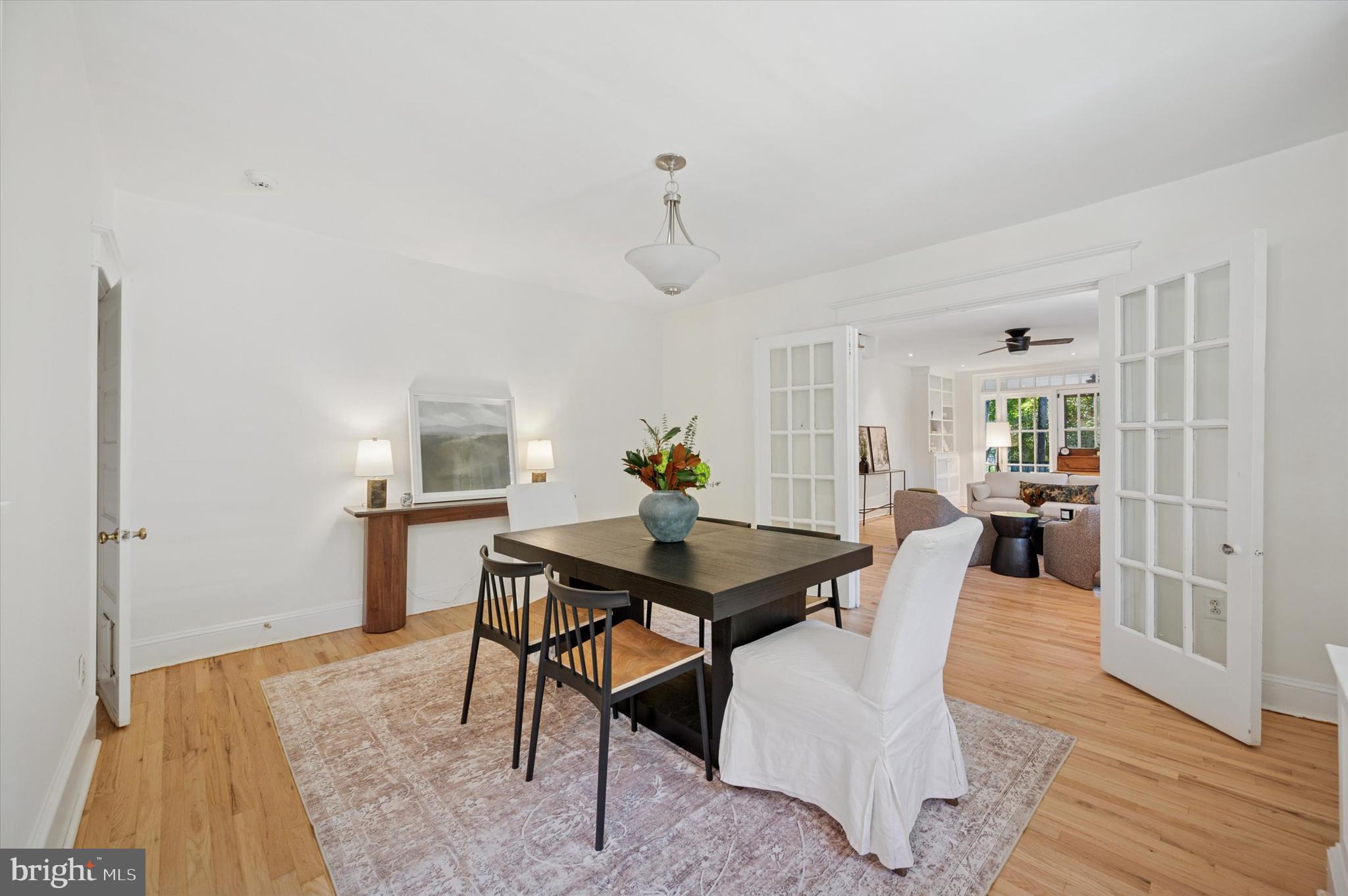 525 Burnham Road Philadelphia, PA 19119 - Photo 8 of 36 a dining room with furniture wooden floor a rug and a chandelier