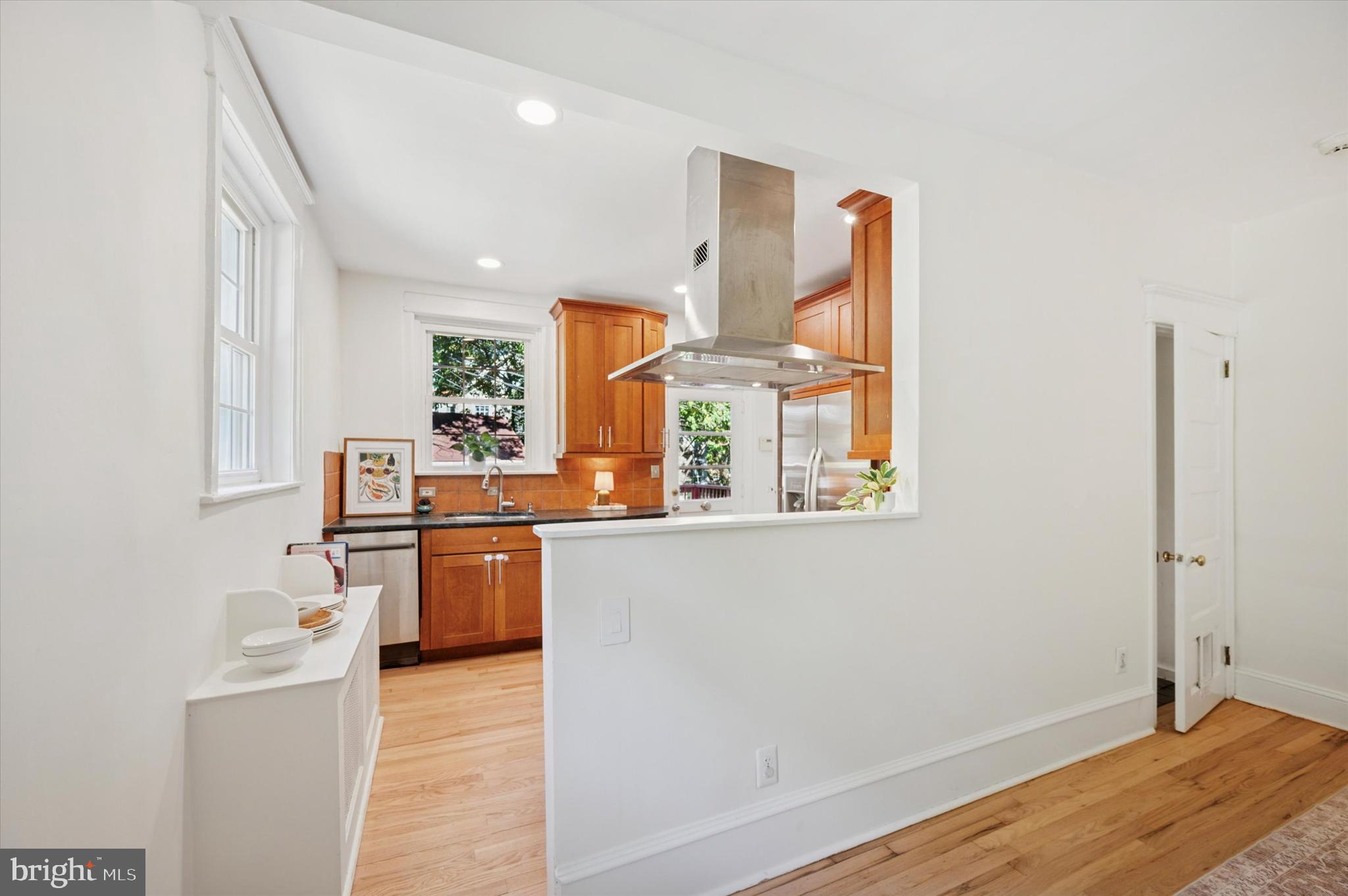 525 Burnham Road Philadelphia, PA 19119 - Photo 10 of 36 a kitchen with stainless steel appliances granite countertop a stove a sink and a refrigerator