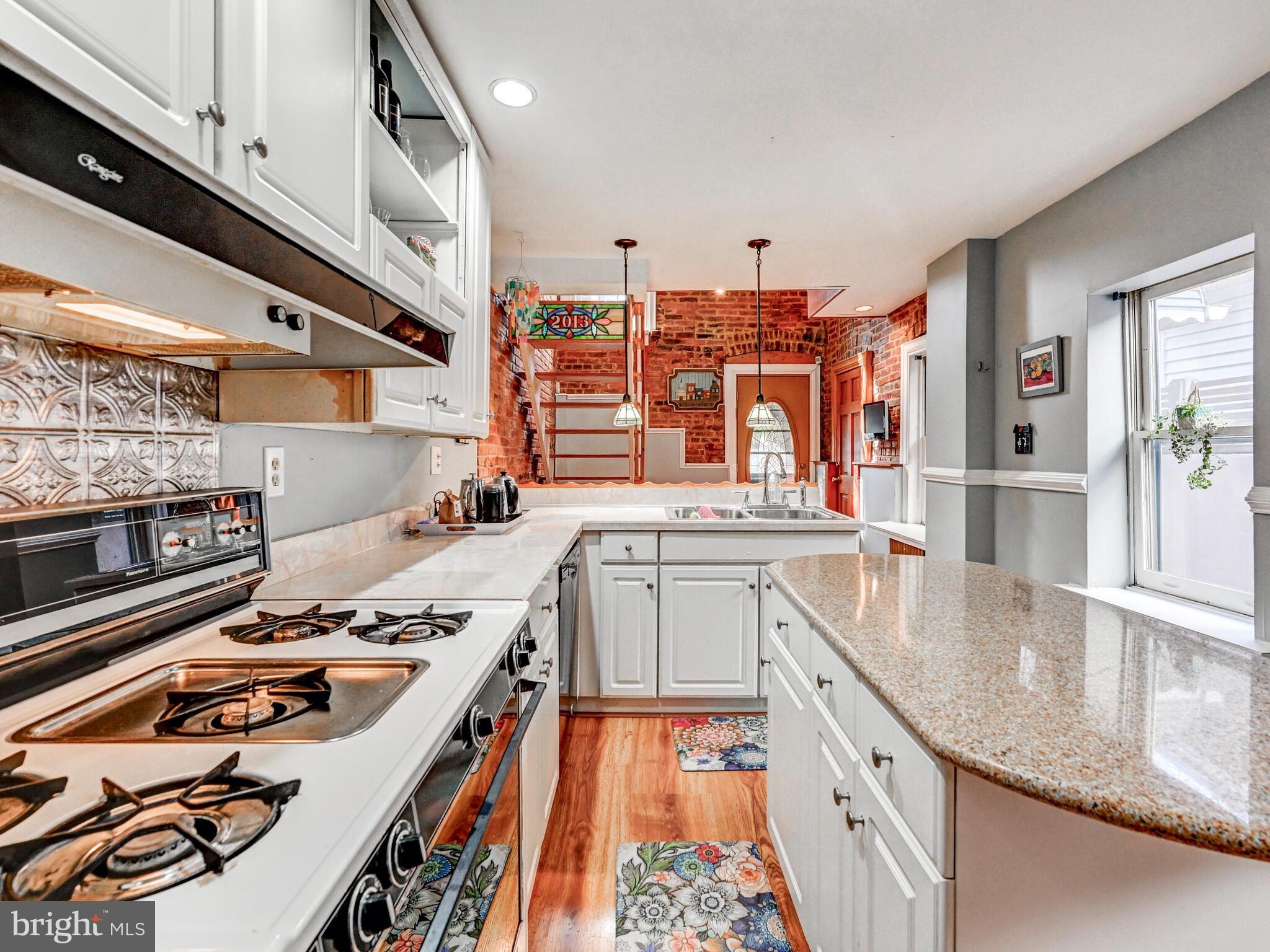 2013 Bank Street Baltimore, MD 21231 - Photo 12 of 38 a kitchen with a stove and a sink