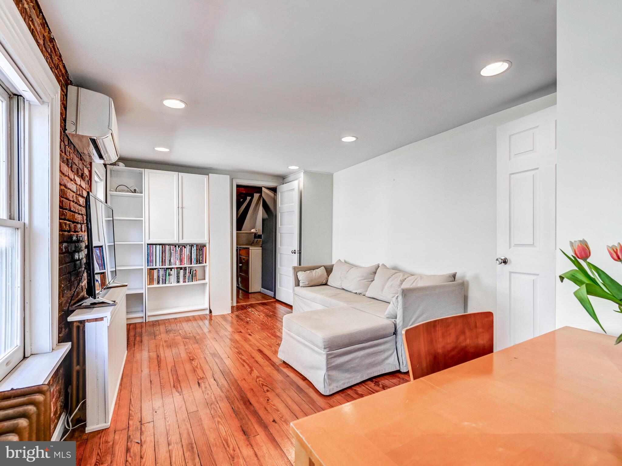2013 Bank Street Baltimore, MD 21231 - Photo 21 of 38 a bedroom with bed and a wooden floor