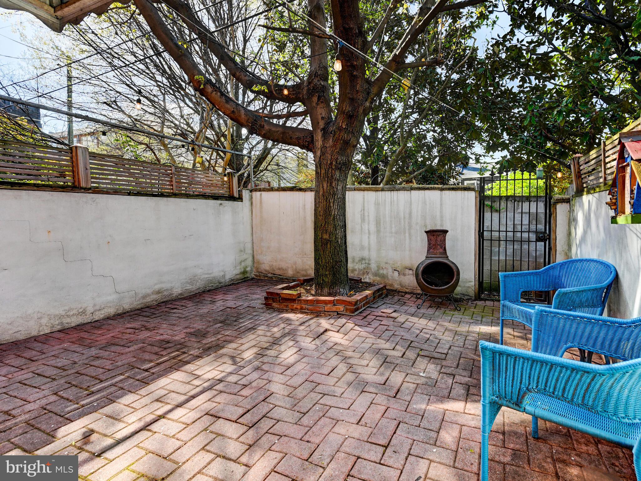 2013 Bank Street Baltimore, MD 21231 - Photo 32 of 38 a backyard of a house with barbeque oven table and chairs