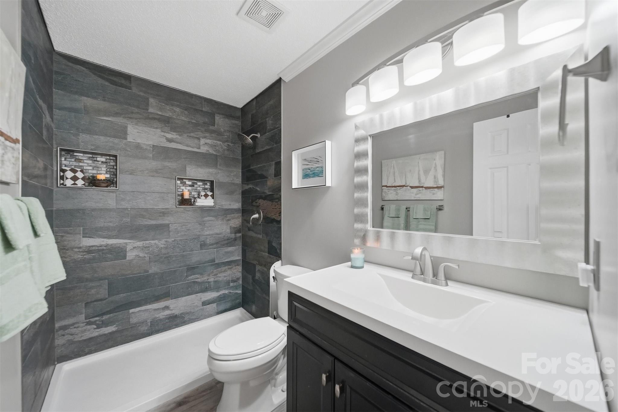 2104 Sheffield Court Northwest Conover, NC 28613 - Photo 13 of 25 a bathroom with a sink toilet and shower