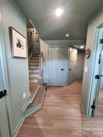 a view of a hallway with staircase