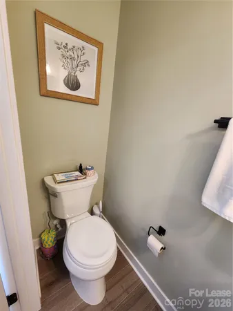 a white toilet sitting next to a bathroom sink