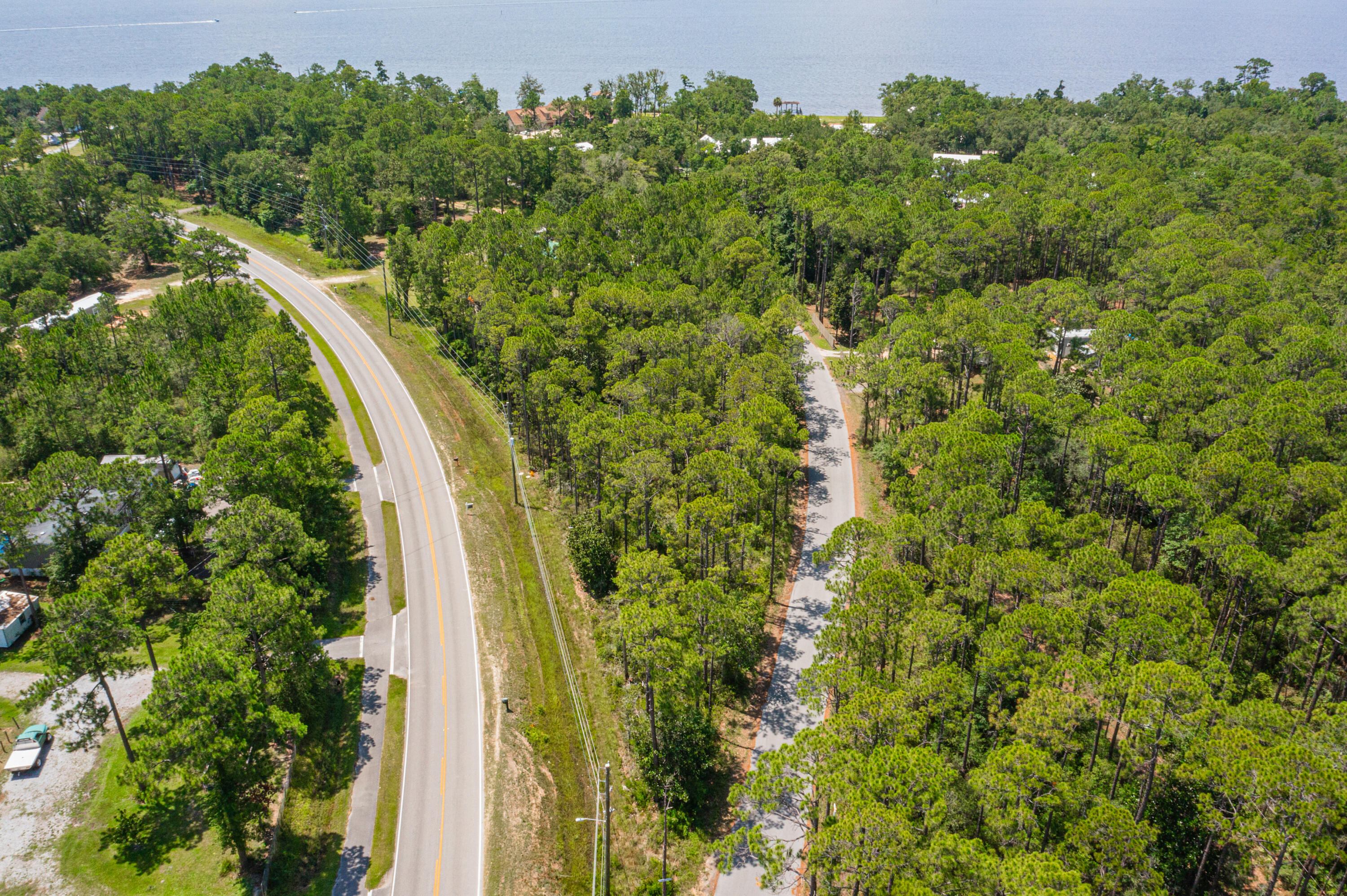 83a Freeport Freeport, FL 32439 - Photo 11 of 16 a view of a yard with plants and large trees