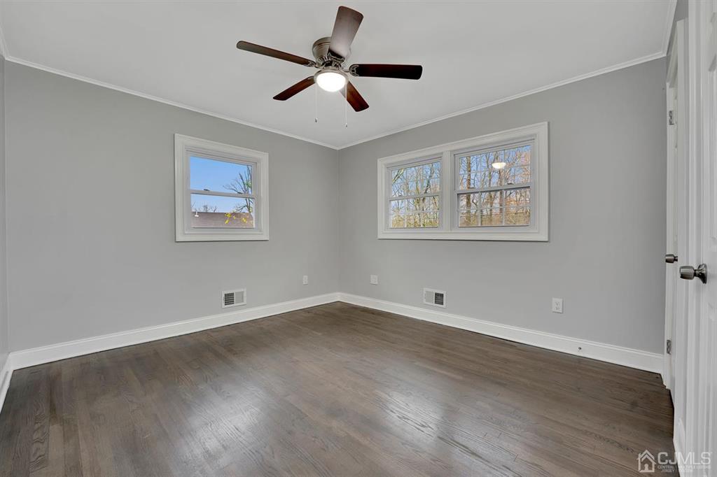 76 Old Road Princeton, NJ 08540 - Photo 2 of 33 a view of an empty room with a window and wooden floor