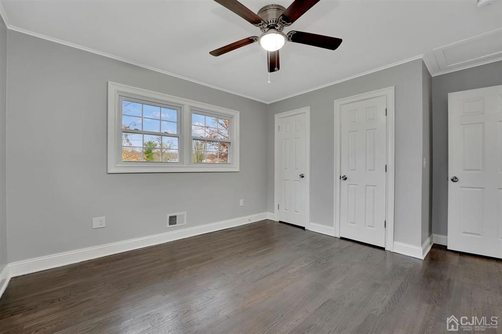 76 Old Road Princeton, NJ 08540 - Photo 4 of 33 a view of an empty room with wooden floor and a window