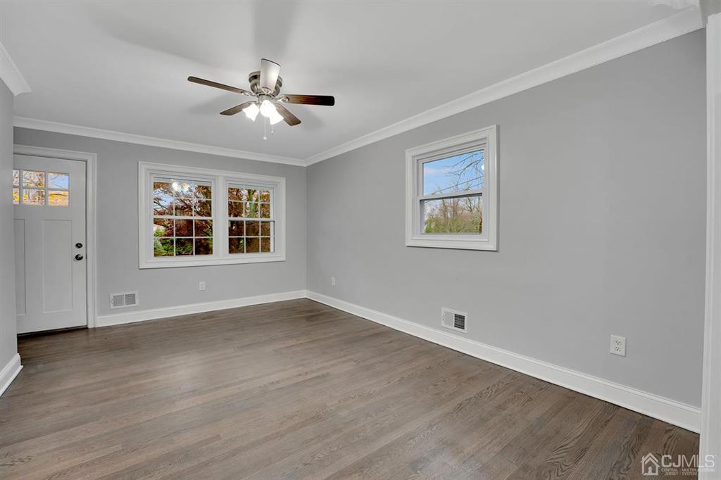 76 Old Road Princeton, NJ 08540 - Photo 9 of 33 a view of an empty room with wooden floor and a window