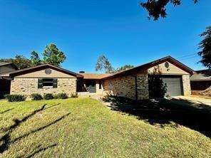 217 Ross Avenue Denison, TX 75020 - Photo 1 of 1 a front view of a house with a yard