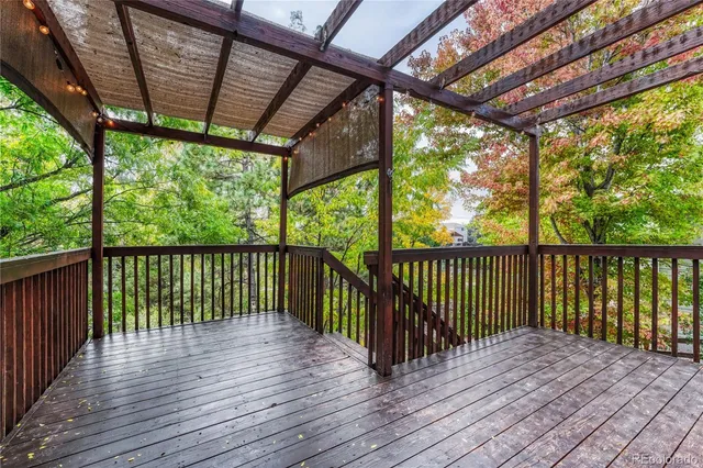 a balcony with wooden floor in outdoor space