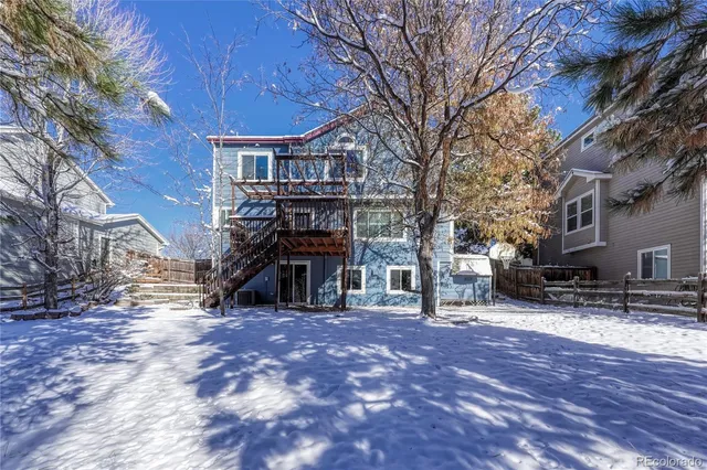a view of a house with a snow on the road