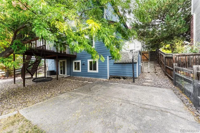 front view of a house with a tree