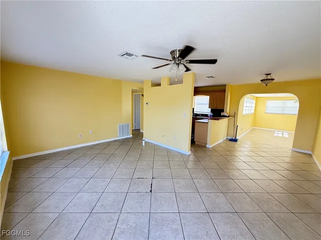 a view of a livingroom with a furniture and a ceiling fan