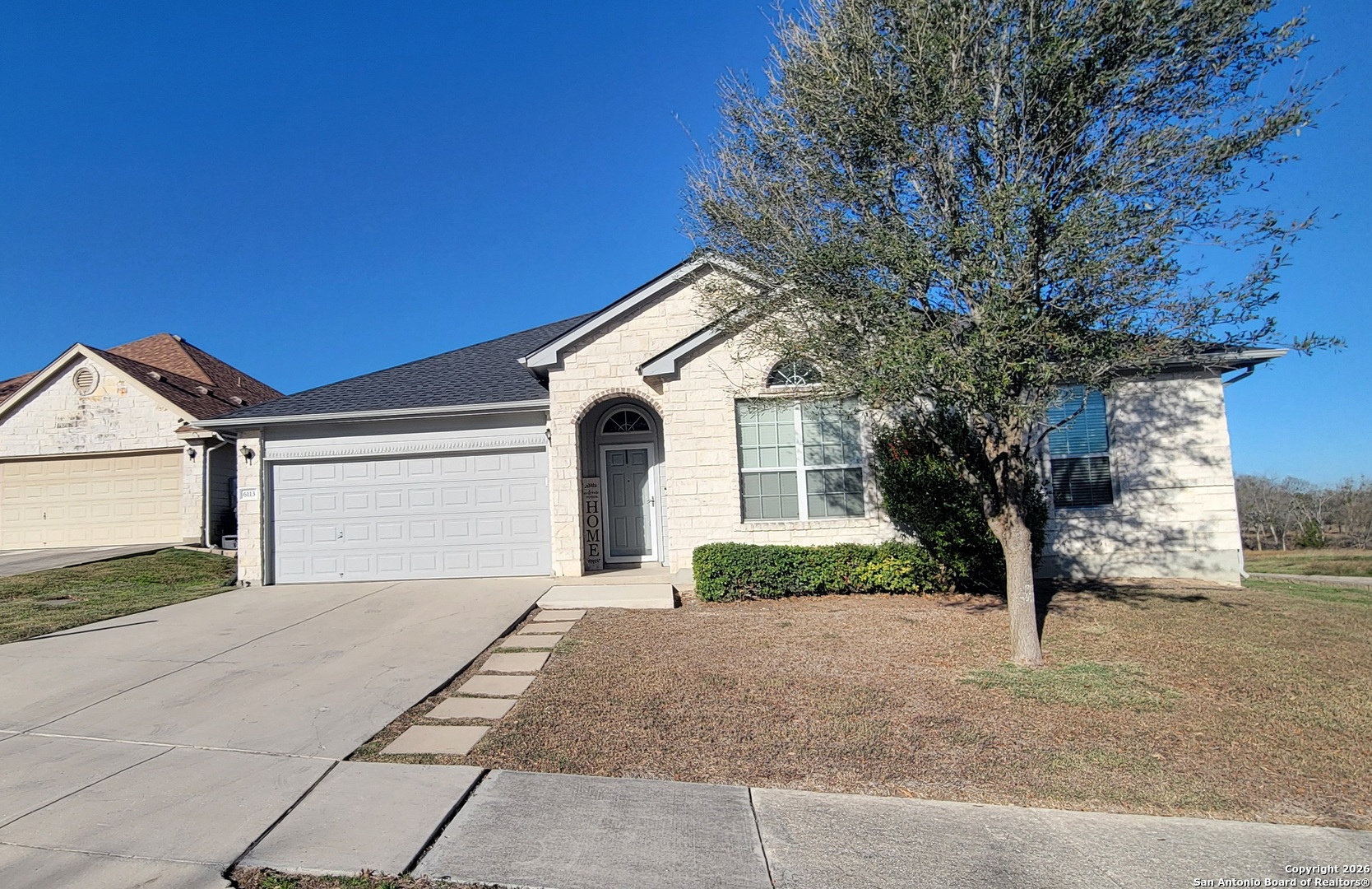 6113 Merion Way Schertz, TX 78108 - Photo 1 of 5 a front view of a house with a yard and garage