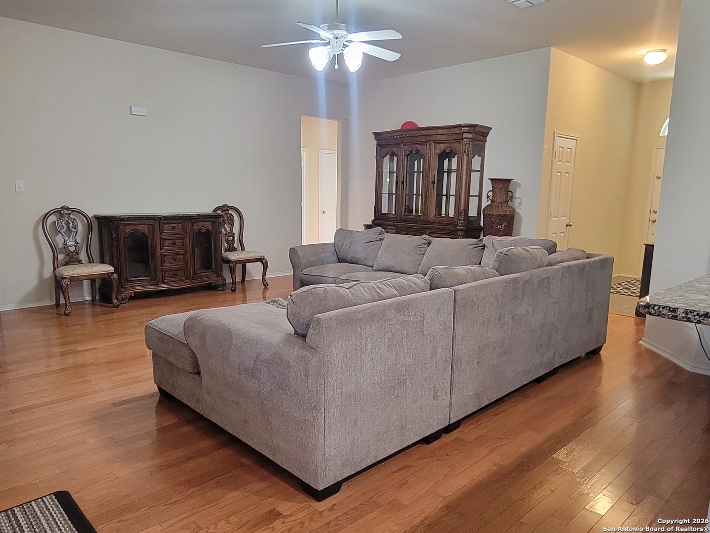 6113 Merion Way Schertz, TX 78108 - Photo 2 of 5 a living room with furniture and a large window