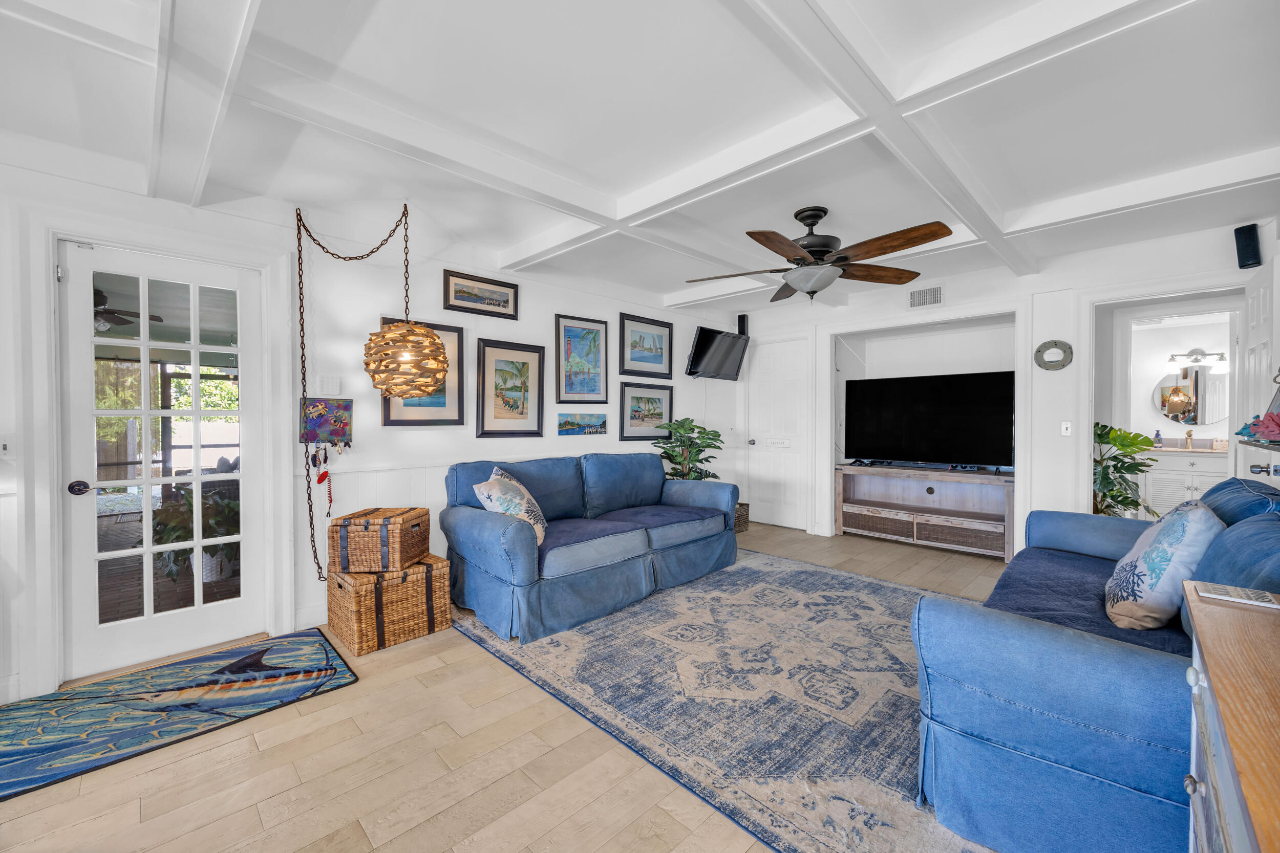 1305 Peninsular Road Jupiter, FL 33469 - Photo 16 of 46 a living room with furniture and a flat screen tv