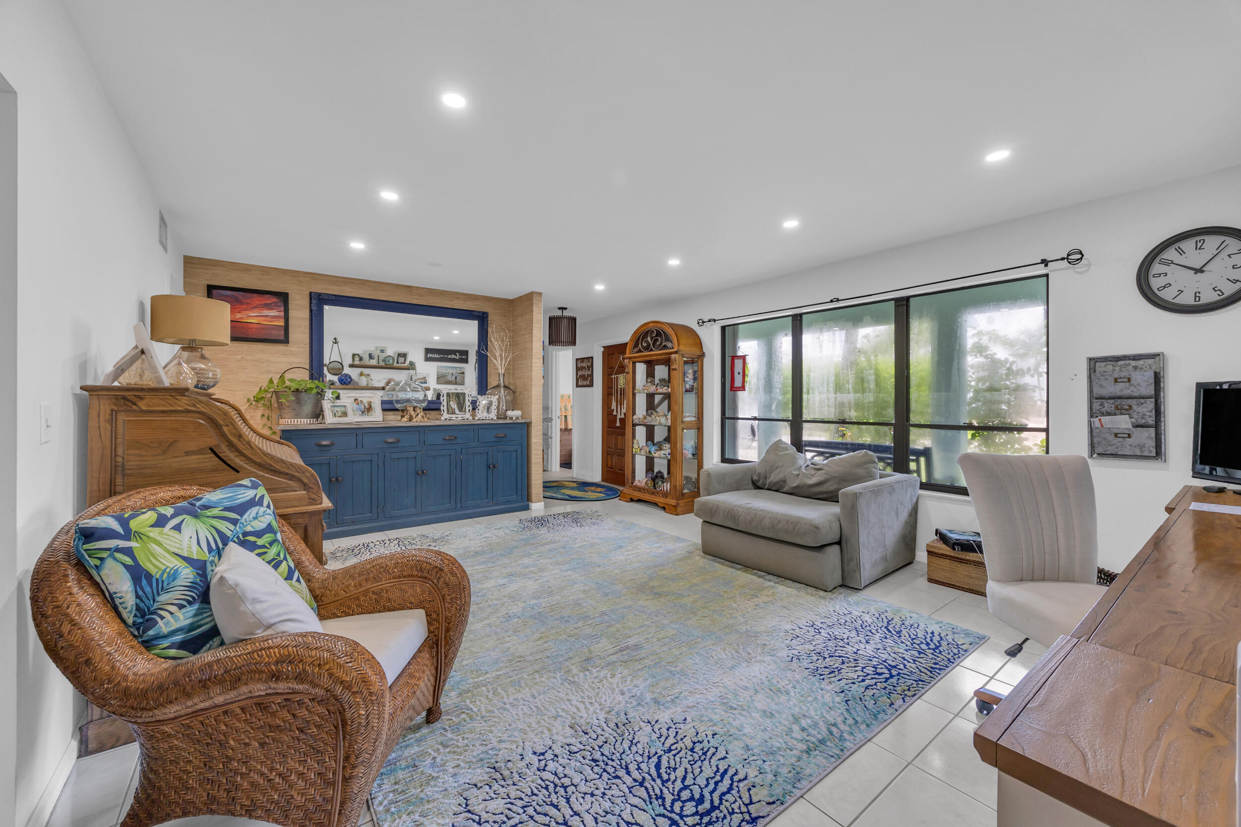 1305 Peninsular Road Jupiter, FL 33469 - Photo 21 of 46 a living room with furniture and a large window
