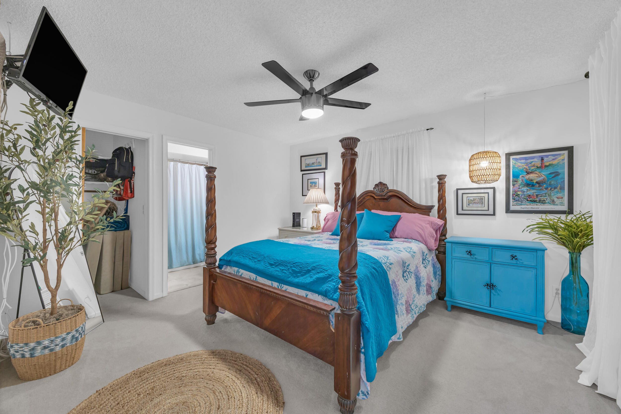 1305 Peninsular Road Jupiter, FL 33469 - Photo 24 of 46 a bedroom with a bed and a flat screen tv