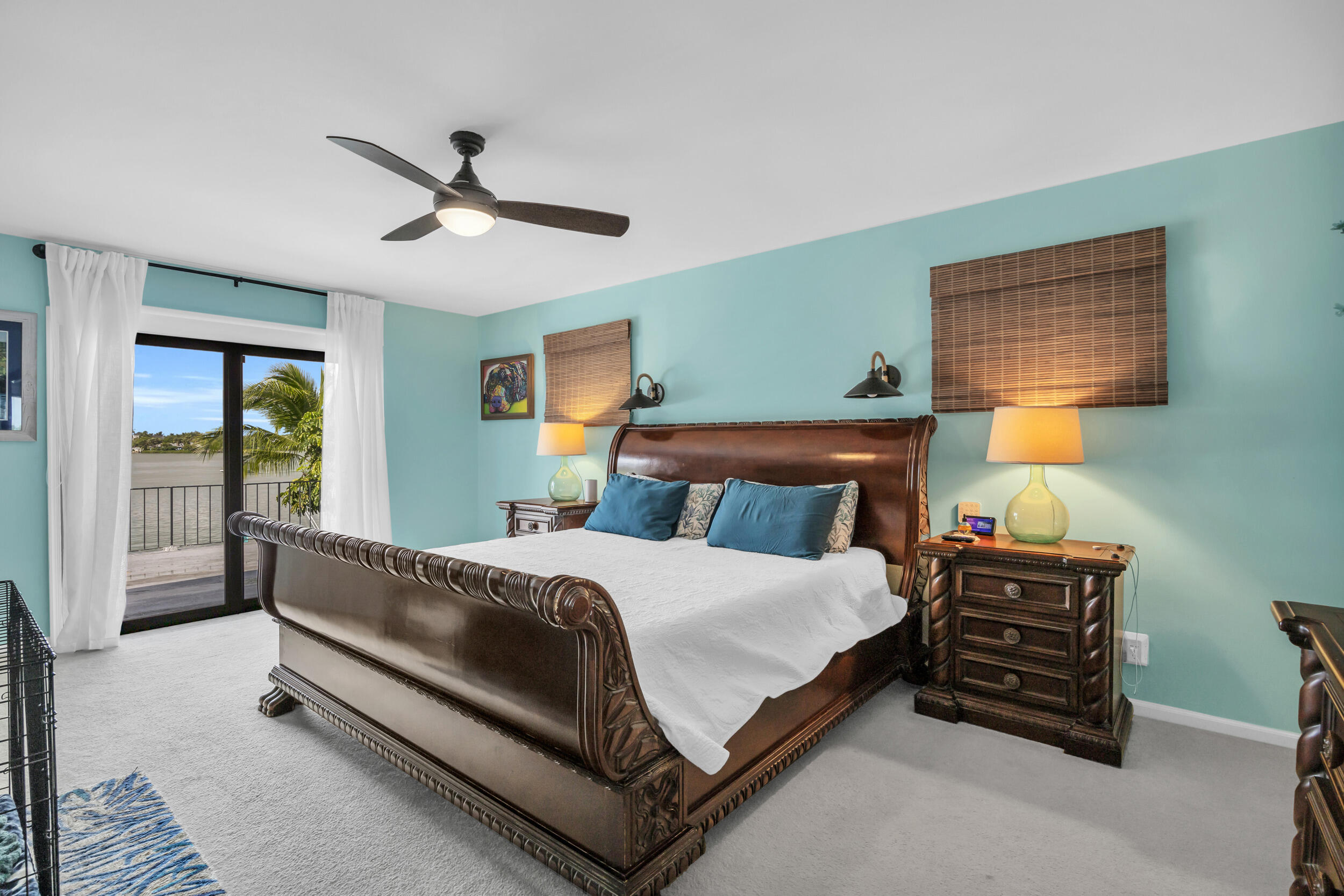 1305 Peninsular Road Jupiter, FL 33469 - Photo 27 of 46 a bedroom with a bed and a chandelier