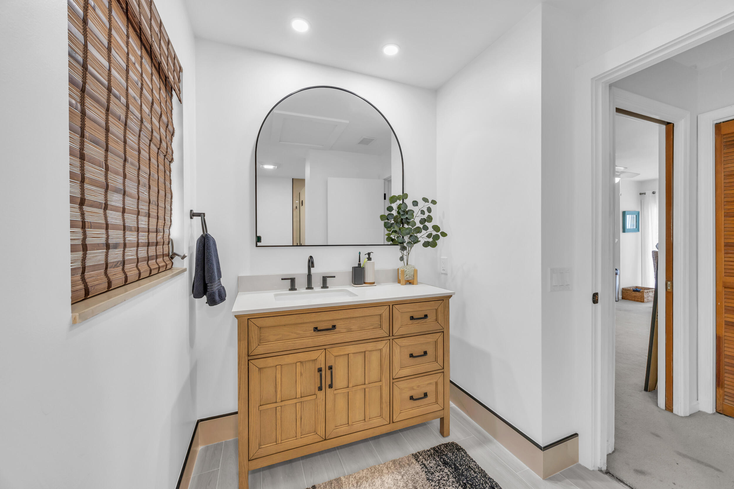 1305 Peninsular Road Jupiter, FL 33469 - Photo 31 of 46 a room with two mirror and a sink