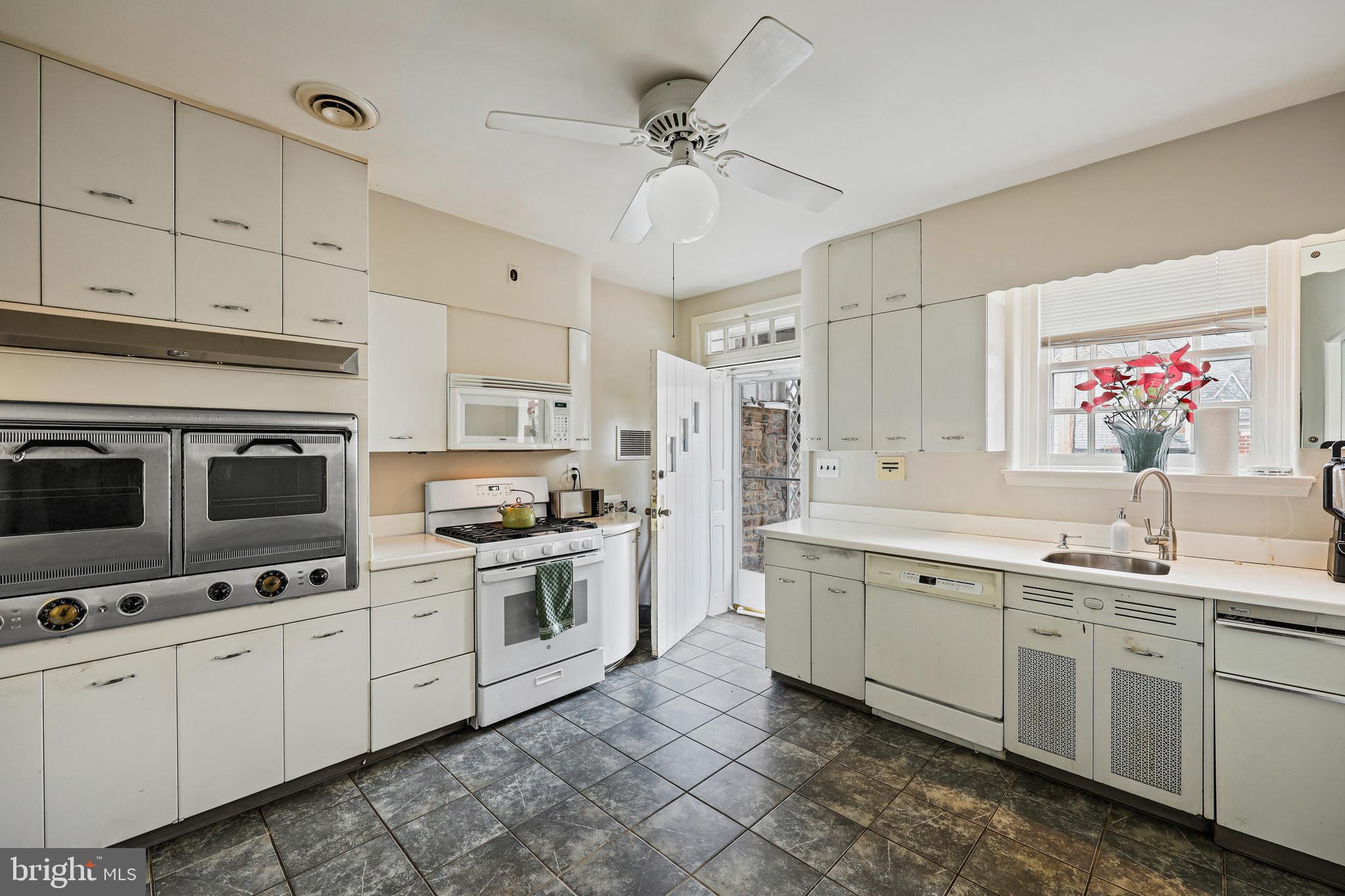 119 St Dunstans Road Baltimore, MD 21212 - Photo 15 of 54 a kitchen with appliances cabinets and a sink
