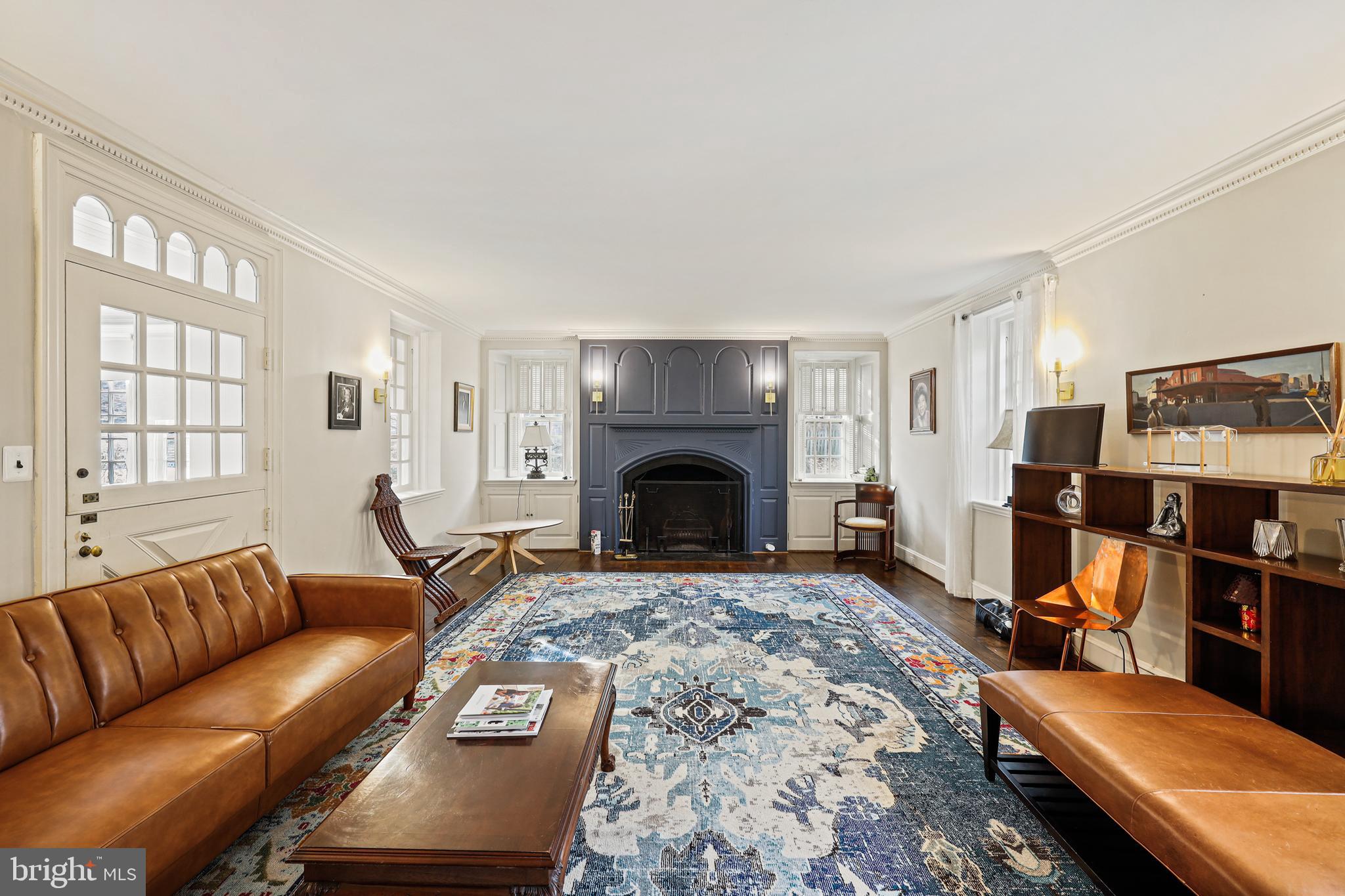 119 St Dunstans Road Baltimore, MD 21212 - Photo 2 of 54 a living room with furniture a window and a fireplace