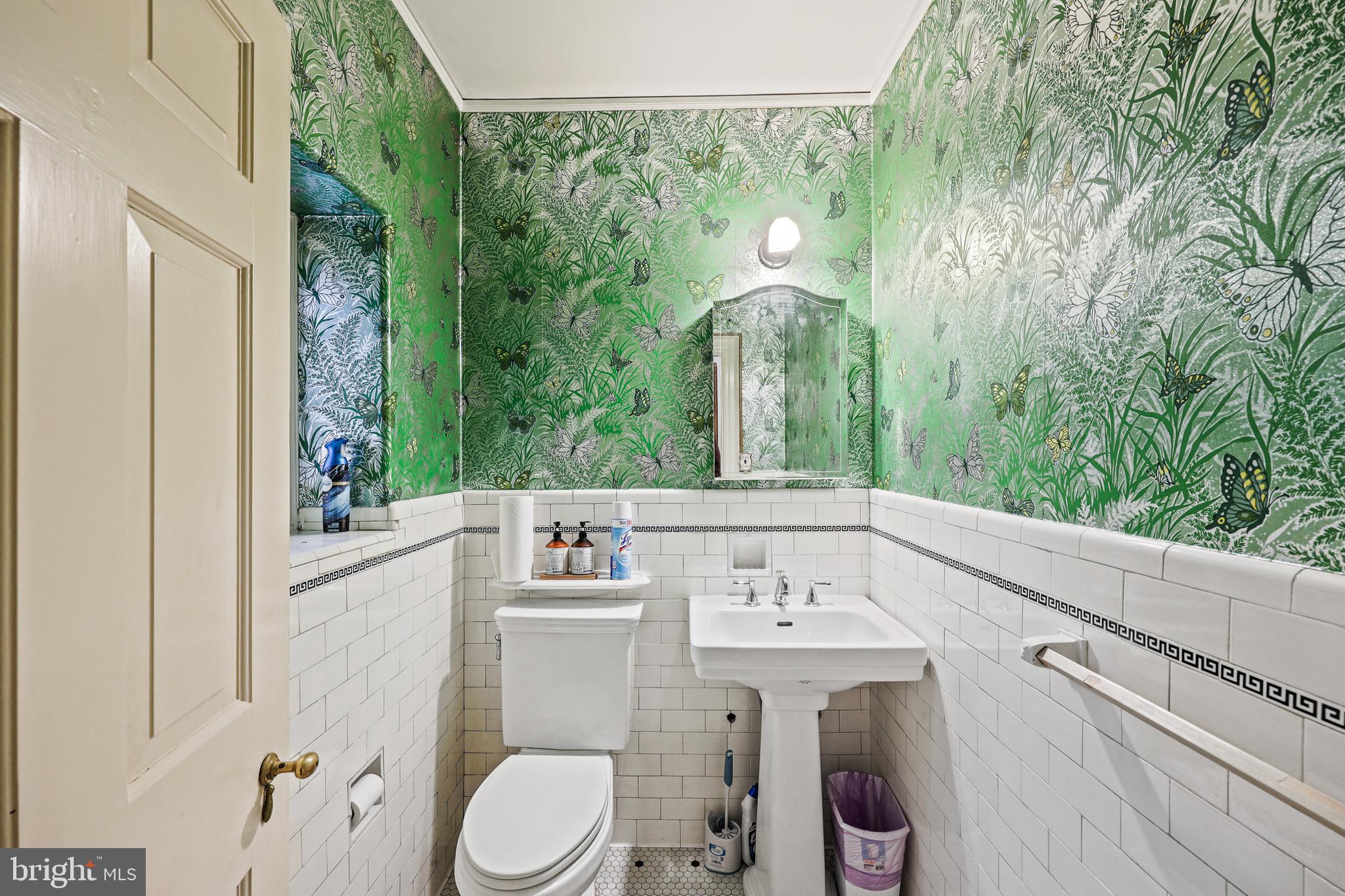 119 St Dunstans Road Baltimore, MD 21212 - Photo 22 of 54 a bathroom with a sink and mirror