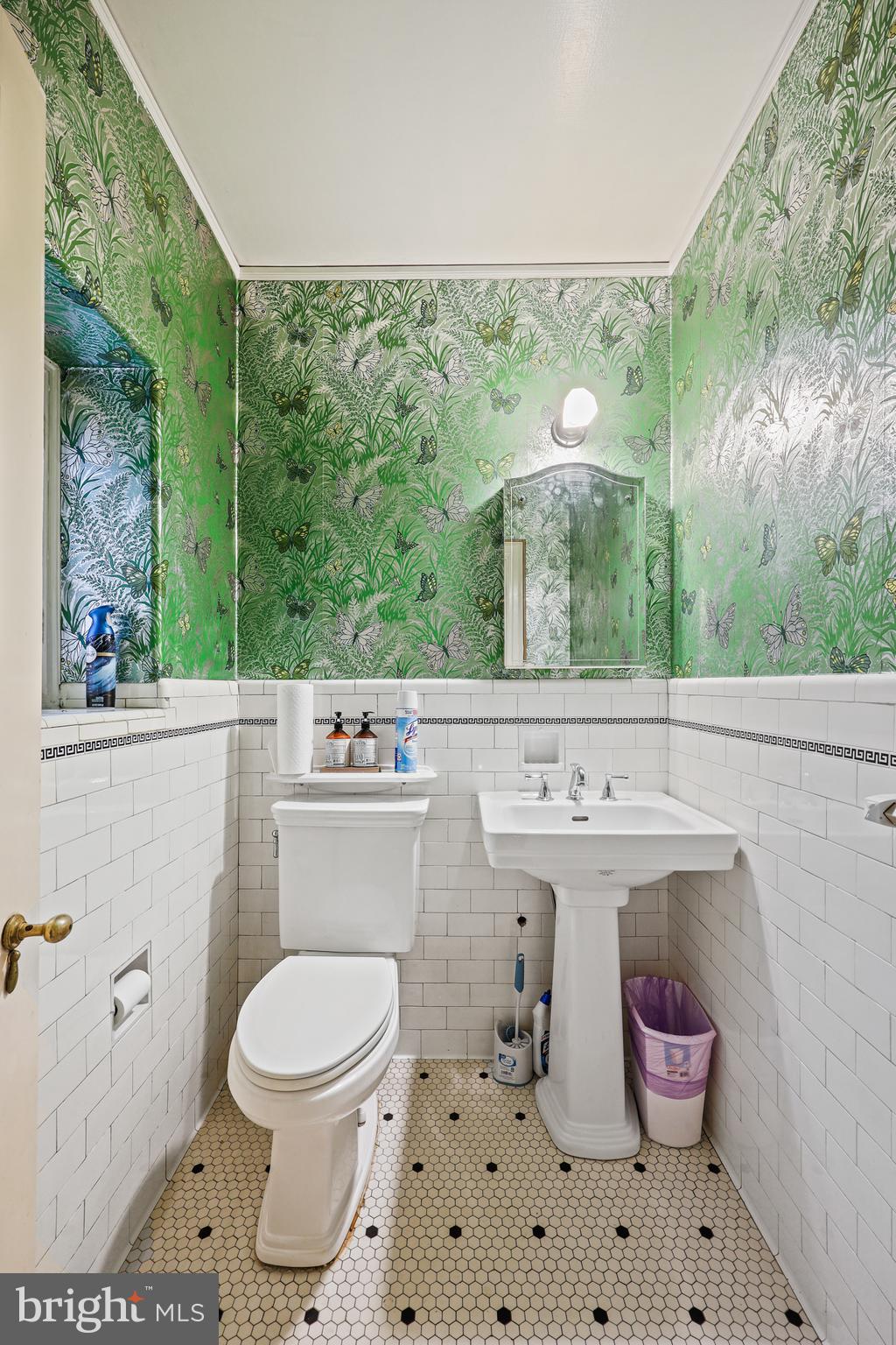 119 St Dunstans Road Baltimore, MD 21212 - Photo 23 of 54 a bathroom with a sink toilet and a mirror