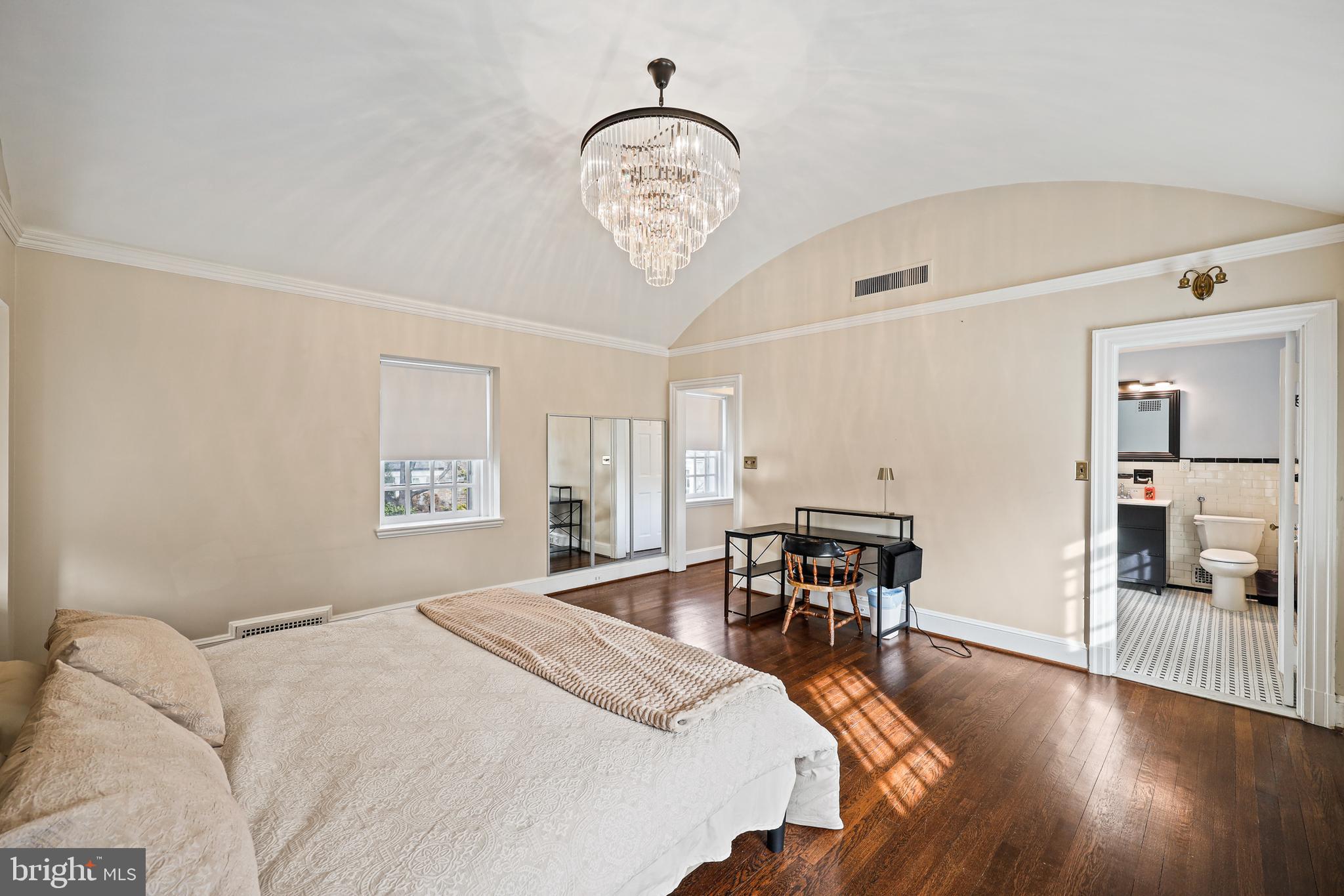 119 St Dunstans Road Baltimore, MD 21212 - Photo 26 of 54 a bedroom with a bed a table and chair