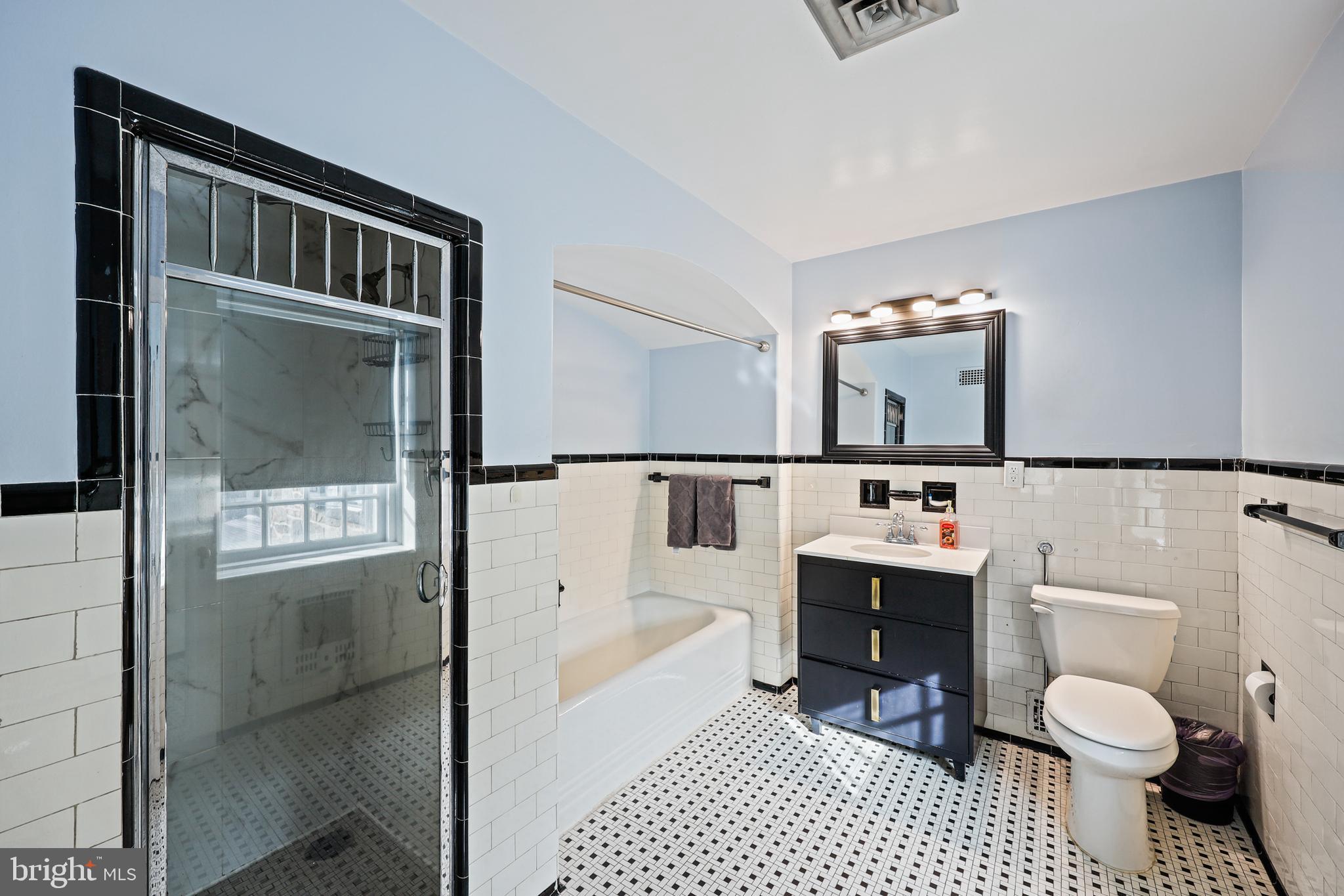 119 St Dunstans Road Baltimore, MD 21212 - Photo 27 of 54 a bathroom with a sink a toilet and shower