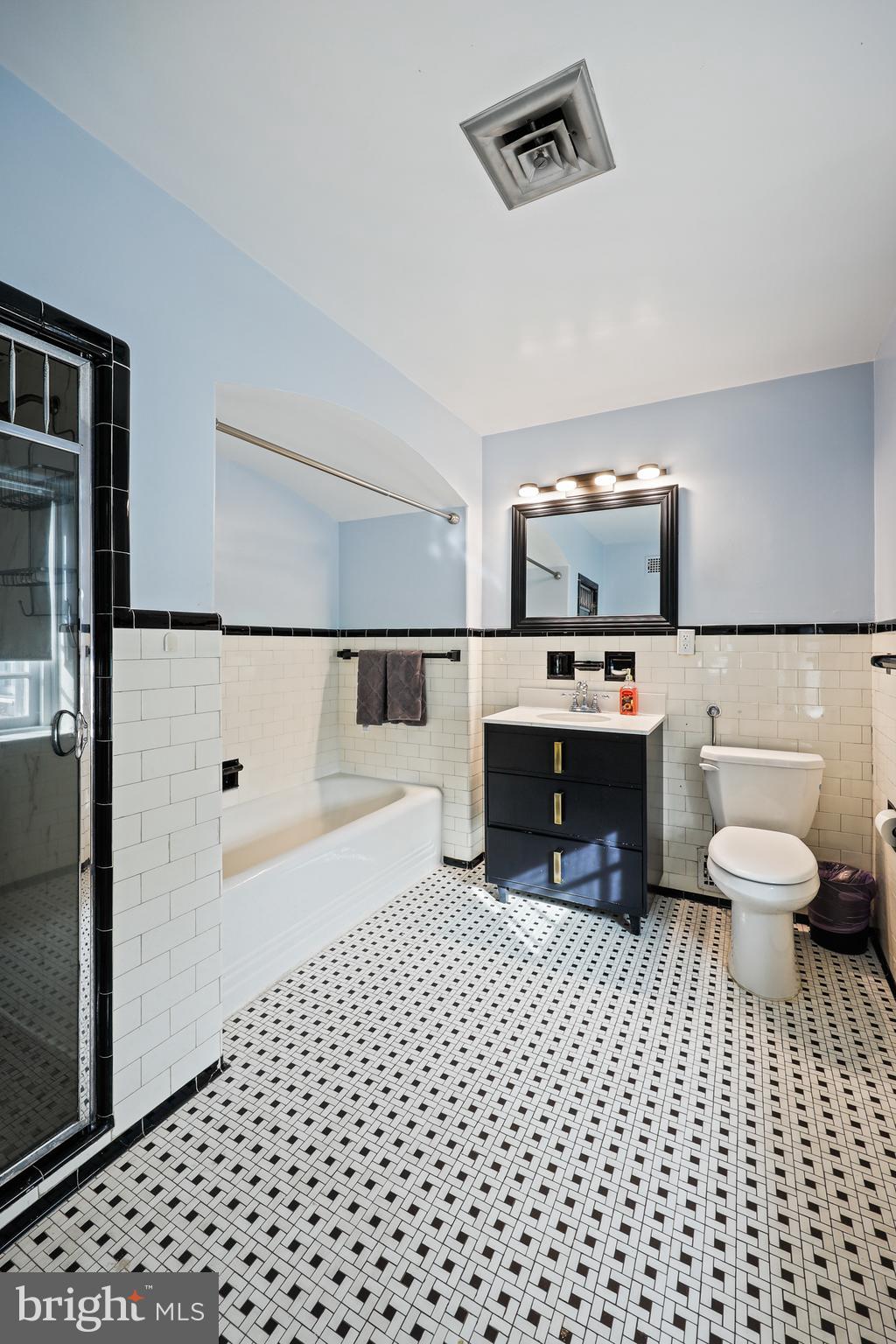 119 St Dunstans Road Baltimore, MD 21212 - Photo 28 of 54 a bathroom with a sink a toilet and a shower