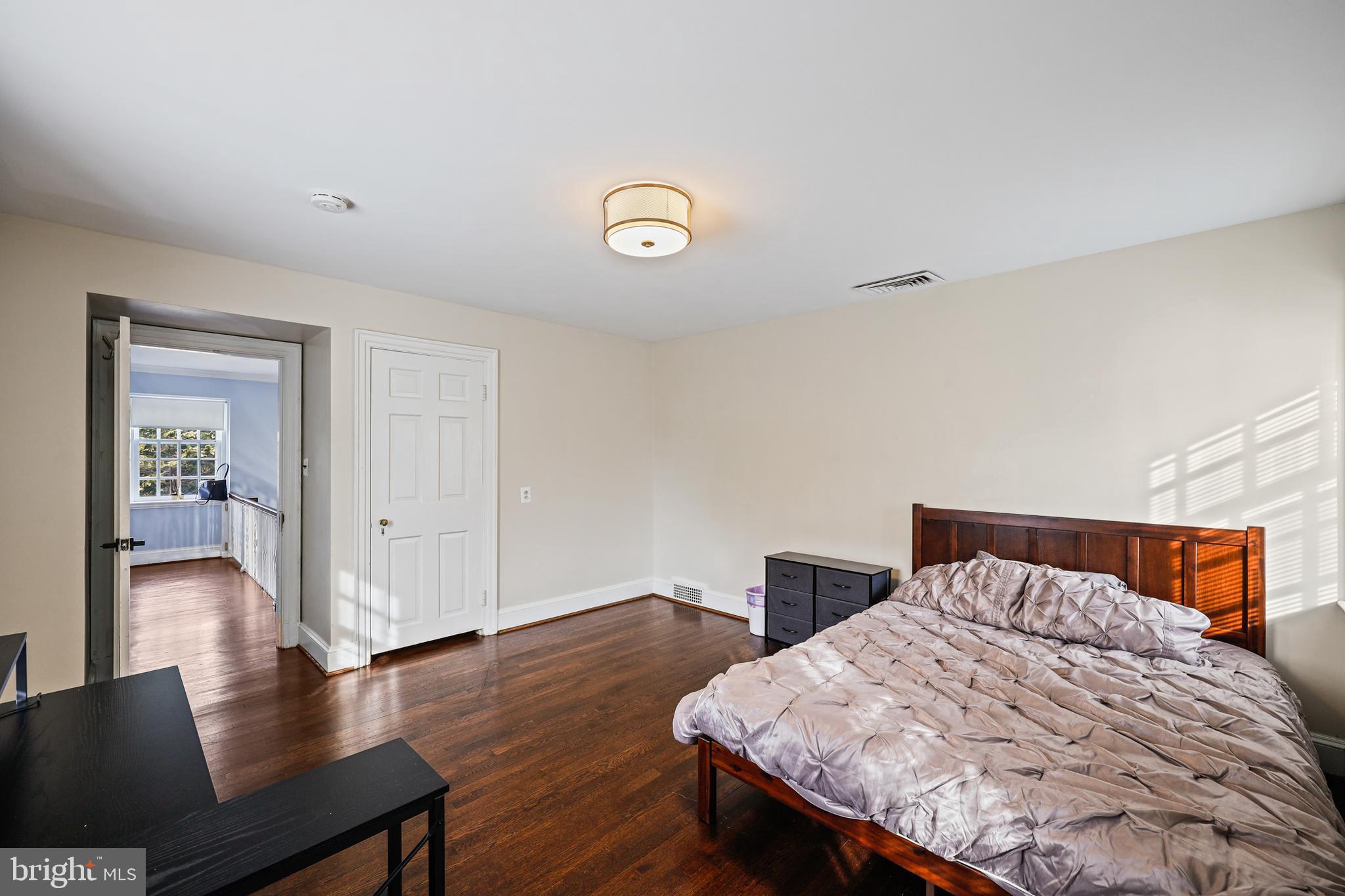 119 St Dunstans Road Baltimore, MD 21212 - Photo 30 of 54 a bedroom with a bed and a table in it