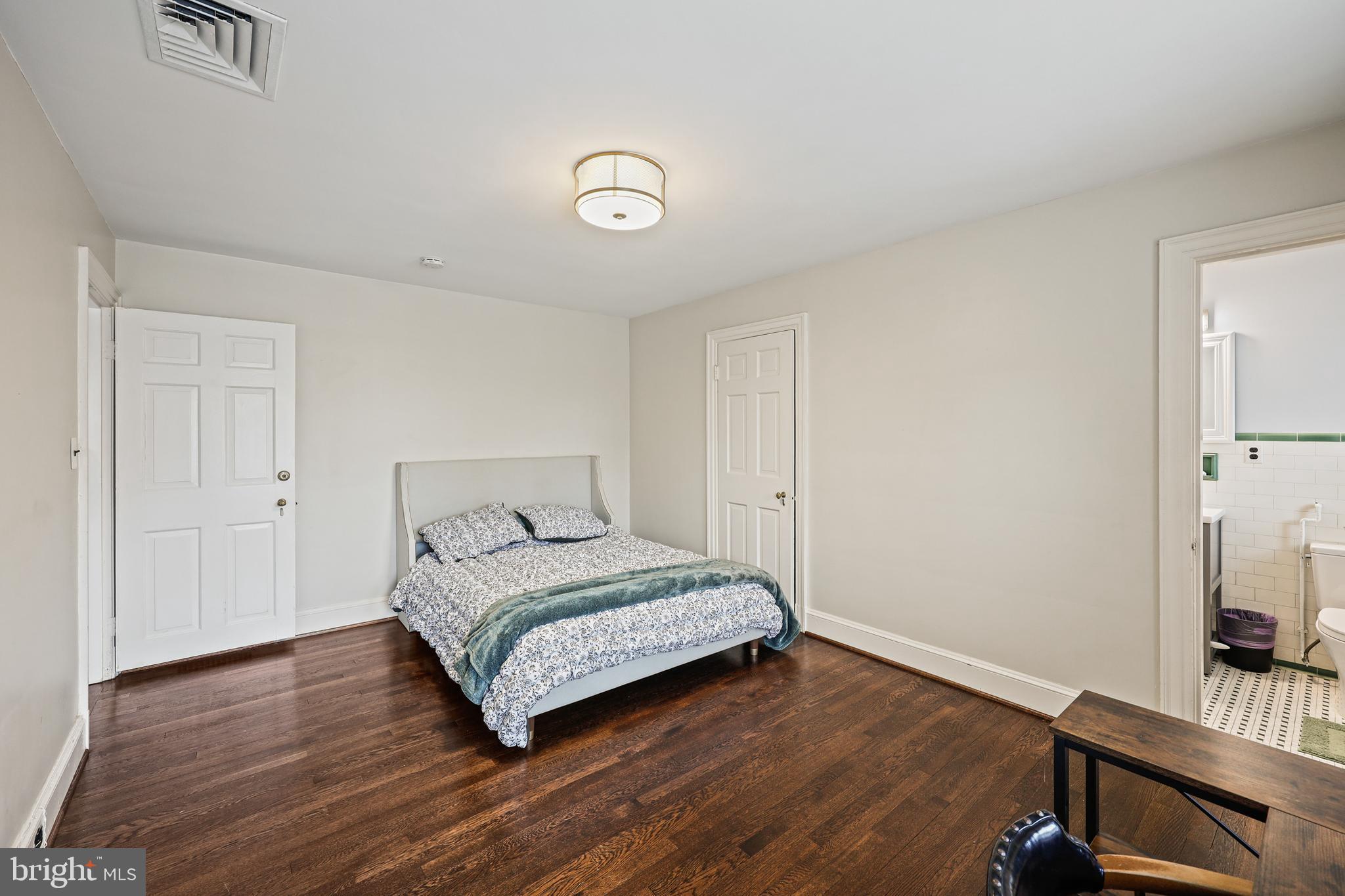 119 St Dunstans Road Baltimore, MD 21212 - Photo 31 of 54 a bedroom with a bed and a flat screen tv