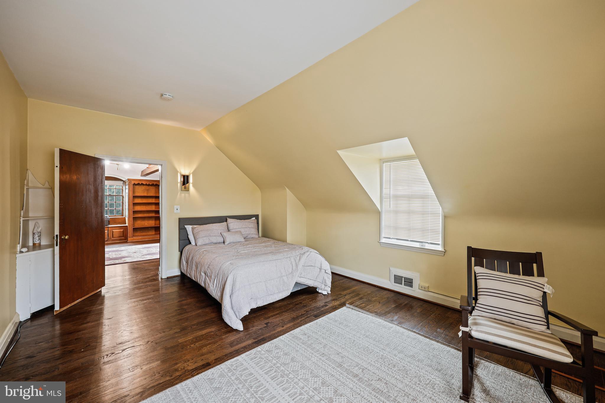 119 St Dunstans Road Baltimore, MD 21212 - Photo 40 of 54 a bedroom with a bed and wooden floor