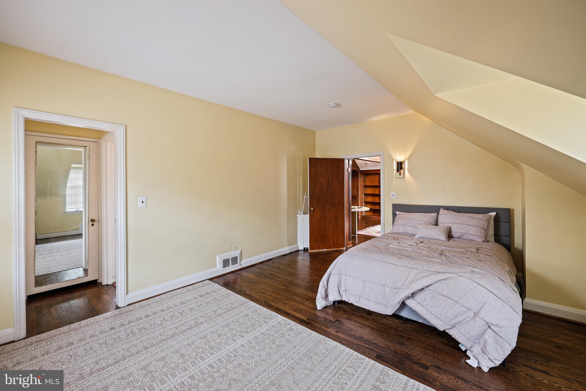 119 St Dunstans Road Baltimore, MD 21212 - Photo 41 of 54 a bedroom with a bed and a walk in closet