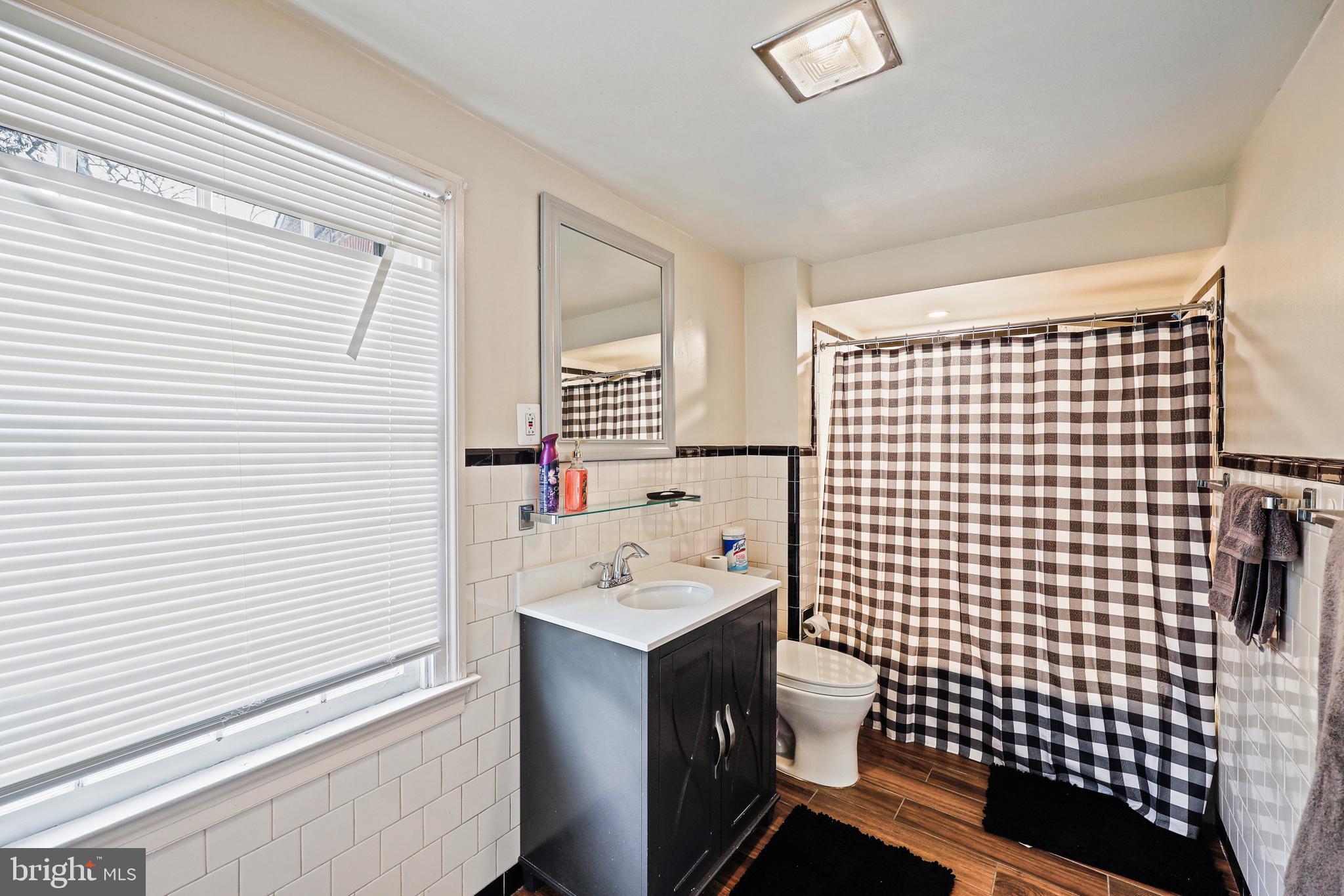 119 St Dunstans Road Baltimore, MD 21212 - Photo 42 of 54 a bathroom with a sink toilet and shower